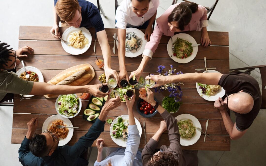 People enjoying healthy food at a social event while staying mindful of her weight loss goals